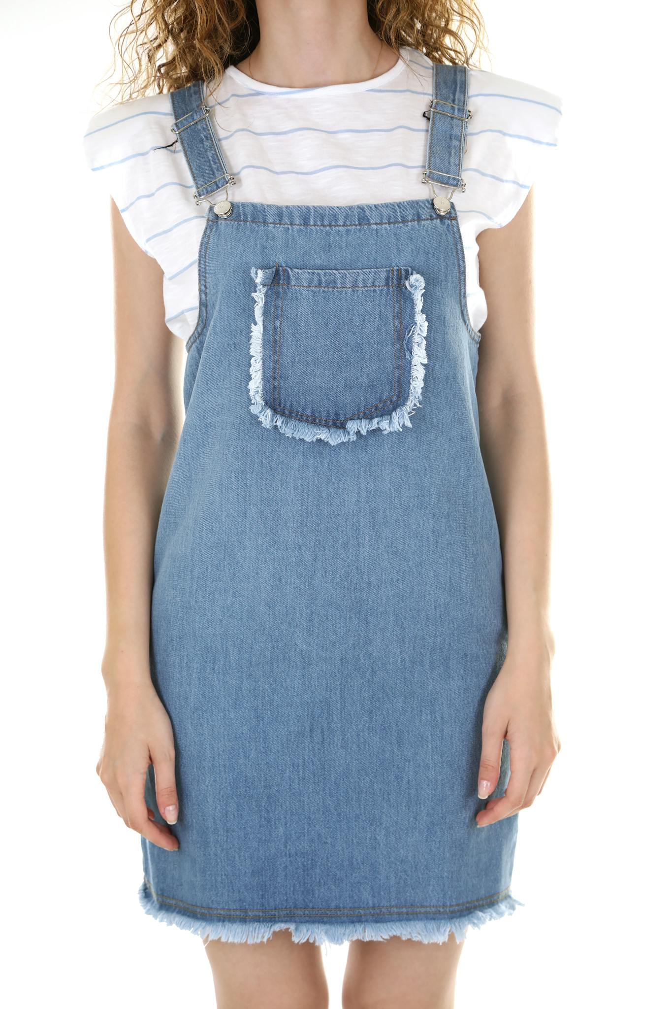 Modern denim dress worn by a female model on a white background.